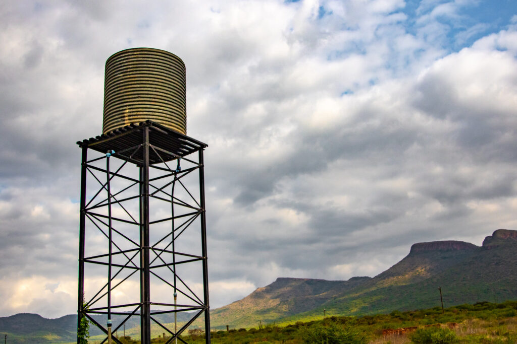 Steel Highline water tank installed on a steel platform elevated from the ground to boost pressure when water is drawn