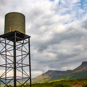 a-water-tank-under-a-cloudy-sky