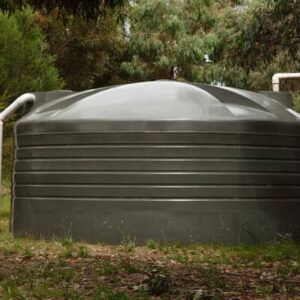 Large water tank in a rural setting.