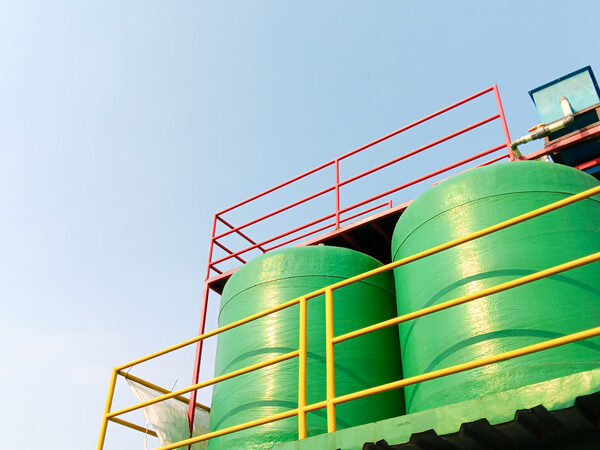 two-green-water-tanks-under-the-sky two-green-water-tanks-under-the-sky